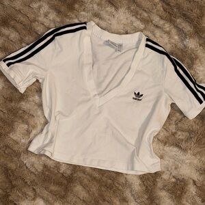 White Adidas Crop Top.
Size Large but Fits Like a Medium.